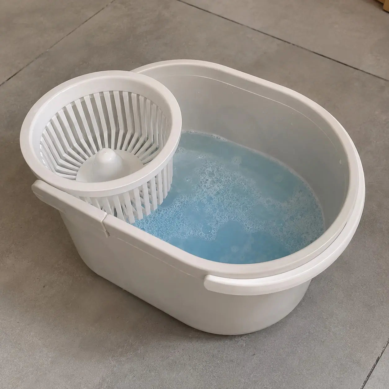 Mop bucket filled with blue cleaning solution