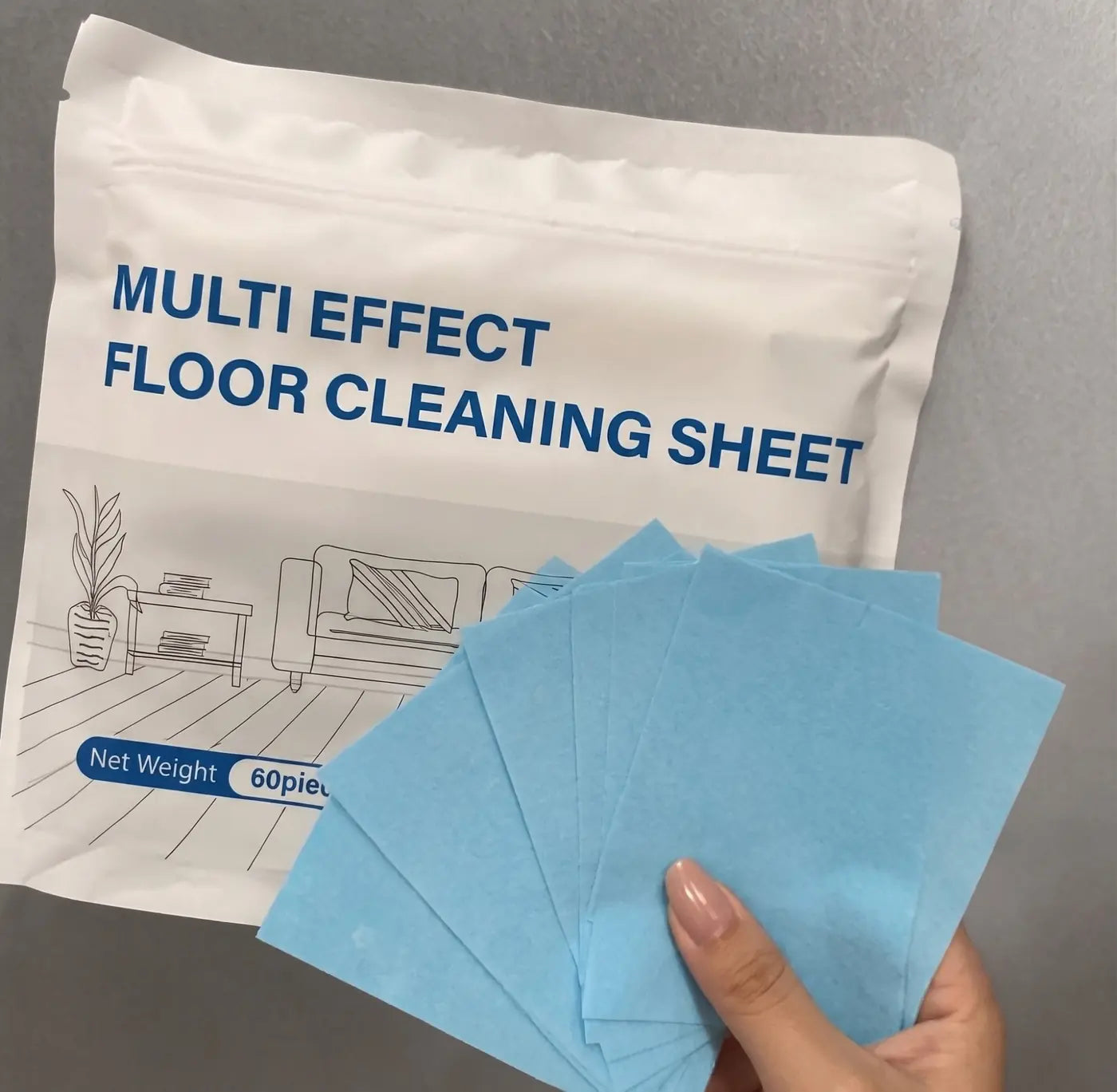 Customer holding blue floor cleaning sheets beside the product package